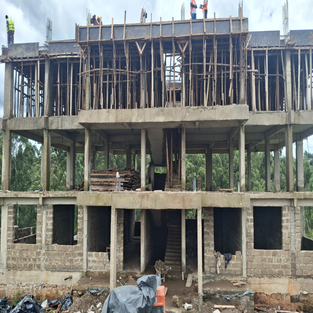Engineers and project managers inspecting the steel rebar and formwork setup before a concrete slab pour